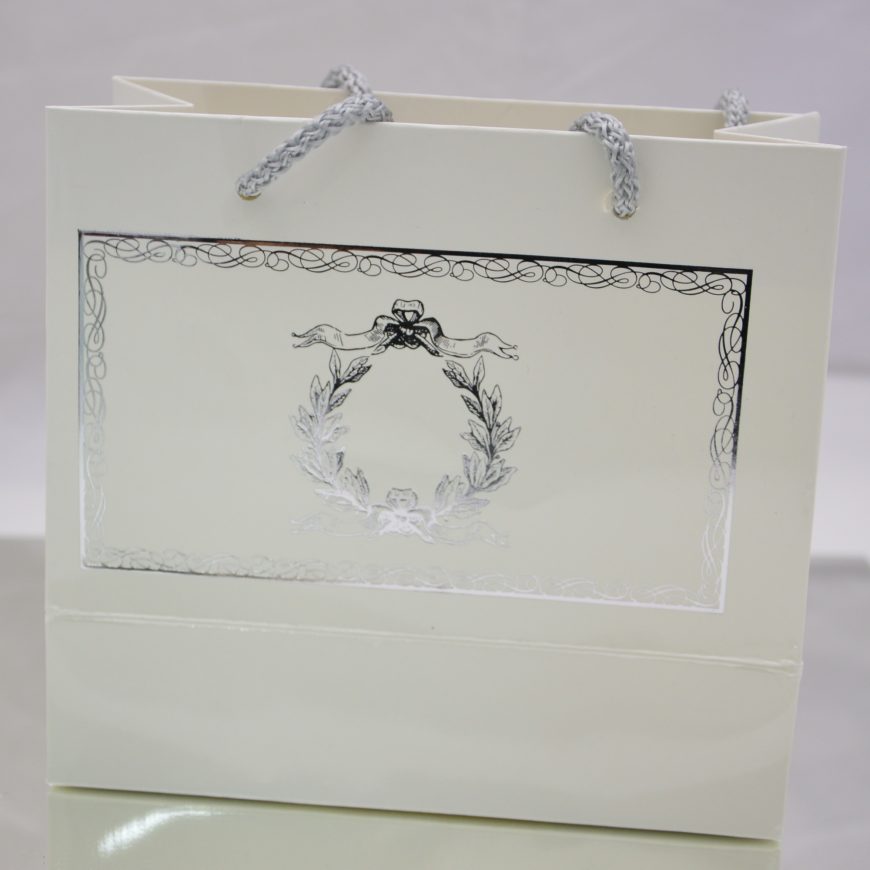 Sac blanc motifs argenté